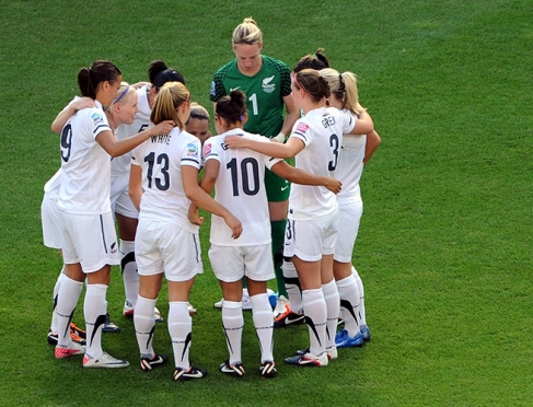 Womens FIFA team in huddle